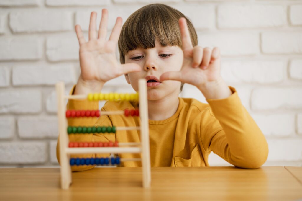 front view child using abacus learn how count 1